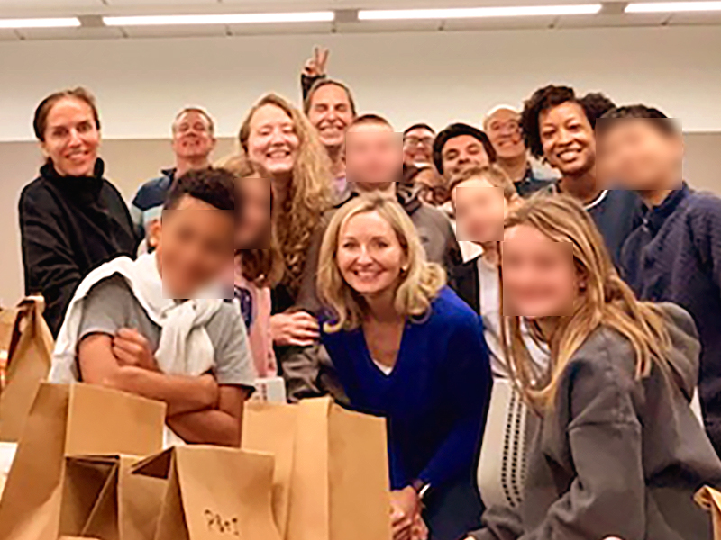Orthopaedic Surgery faculty and volunteers preparing lunches together at Mission Hall