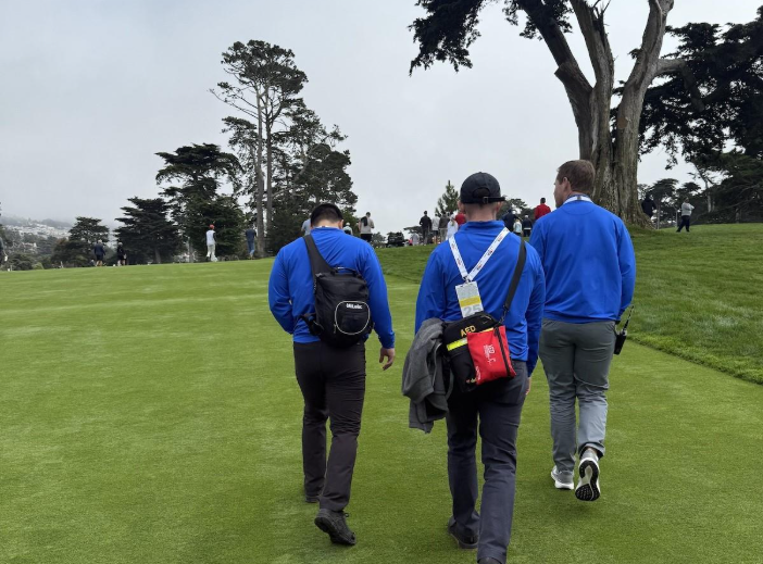 three people walking