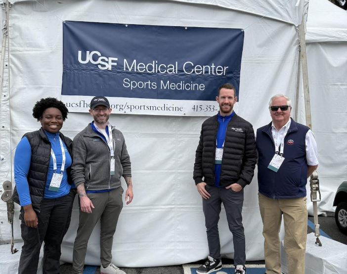 group of people in front of a tent