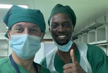 two surgeons smiling