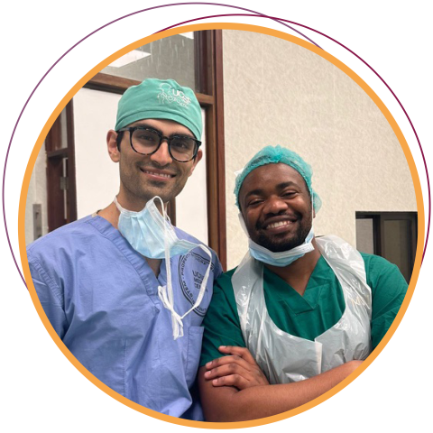 two surgeons in graphic circle smiling